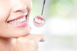 patient checking after teeth whitening